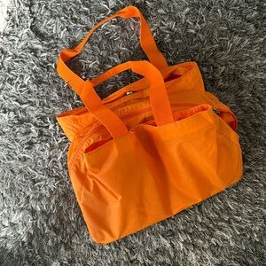 Baggallini orange carry all nylon tote large with pink lining